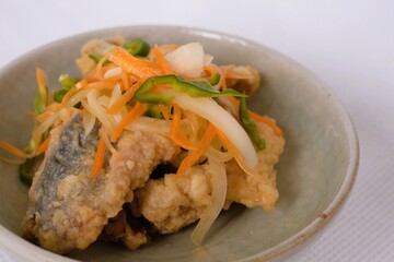 Nanbanzuke , Fried horse mackerel marinated in sweet and spicy vinegar. 
