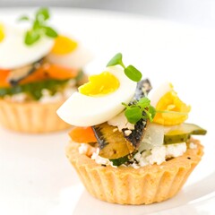 Small savory tarts with egg and vegetables