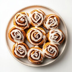 A plate of gluten-free cinnamon rolls with drizzled icing