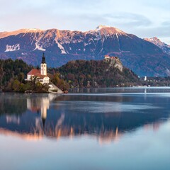 Scenic lake with church and mountains