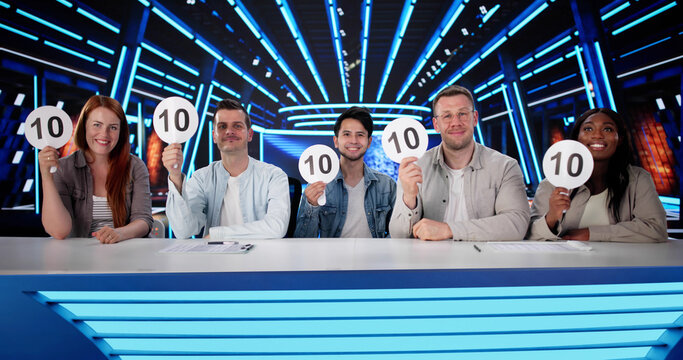 Happy Judges Sitting With Scorecards