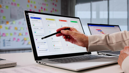 Efficient Woman Uses Kanban Project Management Software On Laptop Calendar