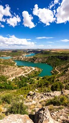 Fototapeta premium Scenic landscape view of a valley with a turquoise river