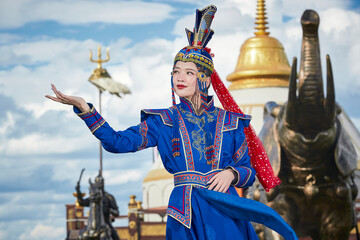 Mongolian girls dressed in luxurious Mongolian costumes on the Mongolian war chariots of the Jinyuan Grand Tent on the grassland