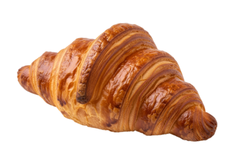Close-up of a golden-brown croissant with flaky layers against a black background