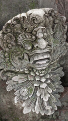 Balinese Ancient Stone Statues and Mythological Sculptures. Traditional Carvings of Frogs, Dragons, Devils, Deities and Guardians at Sacred Monkey Forest Sanctuary Ubud Bali Indonesia.