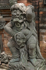 Balinese Ancient Stone Statues and Mythological Sculptures. Traditional Carvings of Frogs, Dragons, Devils, Deities and Guardians at Sacred Monkey Forest Sanctuary Ubud Bali Indonesia.
