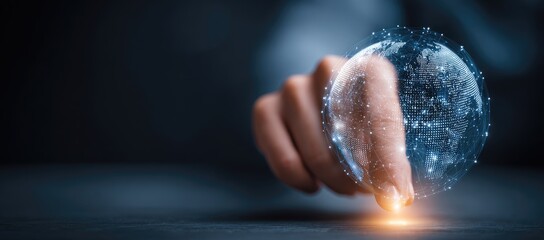A hand touches a digital globe