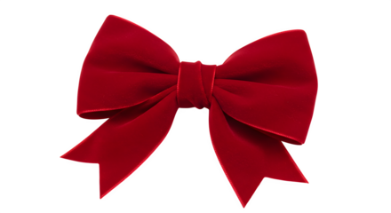 Red velvet bow stands isolated on black. Celebratory aesthetic for holiday designs, gifts, marketing, or packaging.