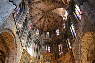 sculpted vault in the nave and the choir of a gothic cathedral in avila in spain