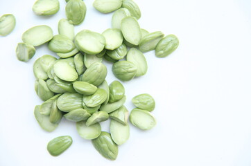A collection of fresh, peeled petai seeds, a popular ingredient in spicy Indonesian cuisine and a flavorful addition to various dishes. Petai, also known as stink beans, is a favorite food 