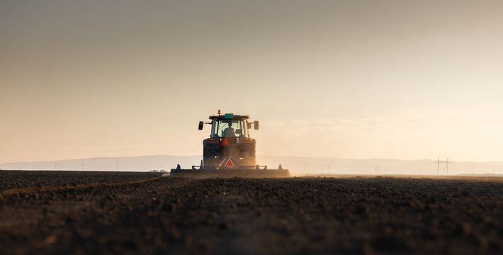 Tractor preparing the land for a new crop planting