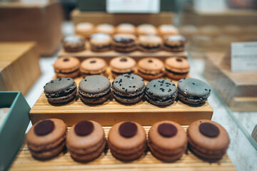 macarons on display in cafe showcasing gourmet variety and sweet indulgence, pastries arranged in bakery highlighting flavorful assortment and tempting elegance