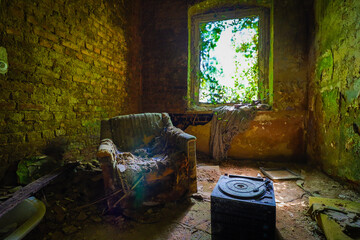 old retro armchair in an abandoned children's home