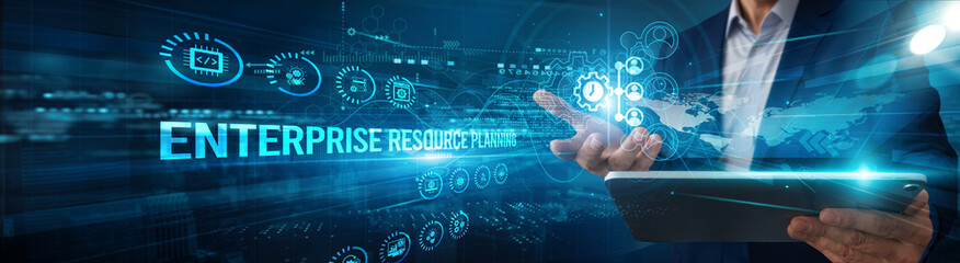 ERP consultant using a tablet to analyze enterprise resource planning system data automation, integration operations modules workflow optimization reporting finance inventory management.