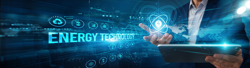 An engineer using a tablet analyzing energy technology system data for renewable, efficiency automation smart grid monitoring innovation sustainability performance solutions.