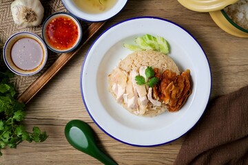 Mixed Chicken and rice ,boied chicken with fried chicken and rice,coriander and cucumber with sauce and soup , hainanese chicken rice, thai called khao man gai,