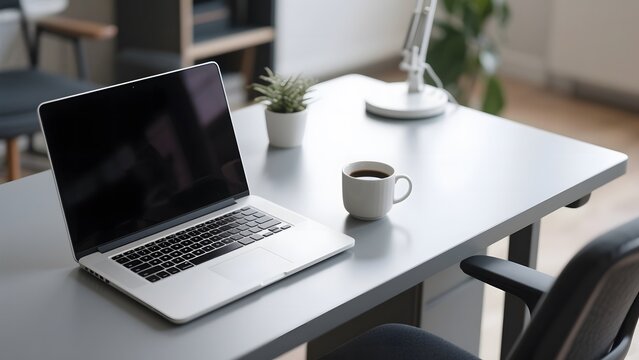 Modern workspace setup with a laptop, coffee mug, and desk lamp on a clean desk