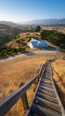 Obraz premium Wooden stairs lead to a white house on a grassy hill Keywords: wooden stairs, outdoor, nature
