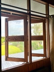 Fototapeta premium Wooden window with natural outdoor, it’s like a piece of nature in your home! 
