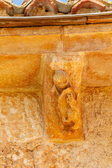 Stone corbel detail of San Lorenzo Church in Zorita del Paramo, Palencia, © Agustin