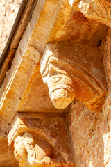 Stone corbel detail of San Lorenzo Church in Zorita del Paramo, Palencia, © Agustin