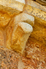 Stone corbel detail of San Lorenzo Church in Zorita del Paramo, Palencia, © Agustin