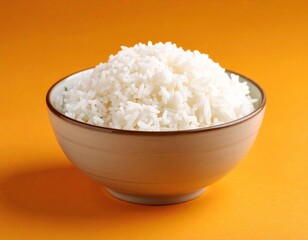 Fluffy White Rice in a Bowl on an Orange Background