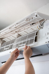 Air conditioner are checking and cleaning the  filters of conditioner