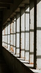 Abandoned Corridor with Cracked Walls and Rusty Bars