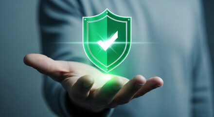 Green shield icon with check mark, levitating above hand, symbolizes security, safety, and protection, ideal for technology or business concepts