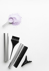 Hairdressing tools for coloring and styling on a white background
