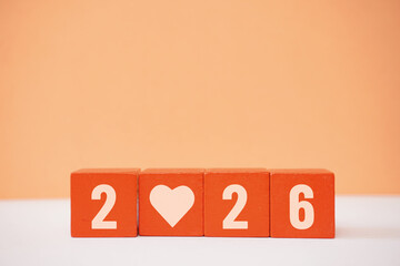 Wooden blocks arranged to display 2026, symbolizing love and optimism for the future.
