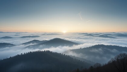 Obraz premium Breathtaking View of Rolling Hills Covered in Fog at Dawn with Faint Sunlight Peeking Through