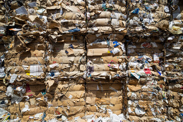 Stacked Bales of Cardboard Waste for Recycling – Sustainable Paper and Packaging Management
