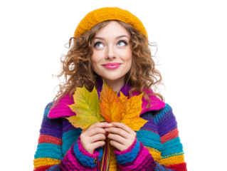 Young woman in colorful sweater holding autumn leaves and smiling