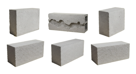 A collection of various concrete building blocks, including cinder and interlocking bricks, for masonry and construction isolated on white.