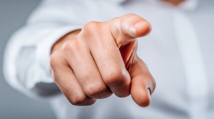 Obraz premium Pointing Hand Gesture: A closeup shot of a hand, extending a finger in a gesture of directness and focus, emphasizing engagement in this moment.