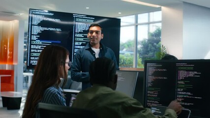Group of A multicultural Software Developer working on laptop computer Writing Code on Desktop Computer in Co working Office Space. Professional Programmer Working on Coding Development Startup. - Powered by Adobe