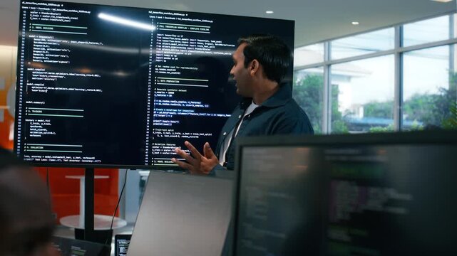 Group of A multicultural Software Developer working on laptop computer Writing Code on Desktop Computer in Co working Office Space. Professional Programmer Working on Coding Development Startup. - Powered by Adobe