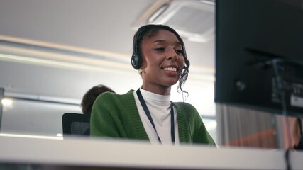 Telemarketing, Young Female Customer Service Agent talking, typing and helping client via headset using computer in call center office. Professional Female IT Support, Operator talk with client.