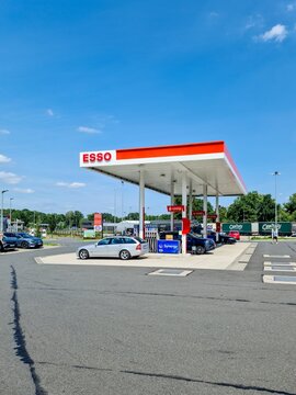 Hildesheim, Germany - 09. August 2025: Cars refueling at Esso gas station in Hildesheim, Germany
