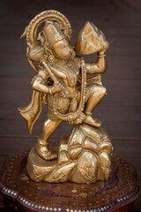 Fototapeta premium Golden Statue of Hindu Deity Hanuman Holding Mountain