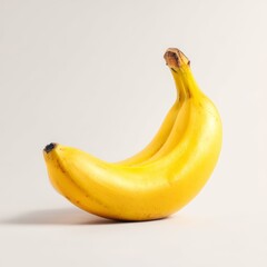 A single, ripe banana with a vibrant yellow peel, perfect for a healthy snack or adding to a recipe. It's a symbol of natural goodness and delicious simplicity