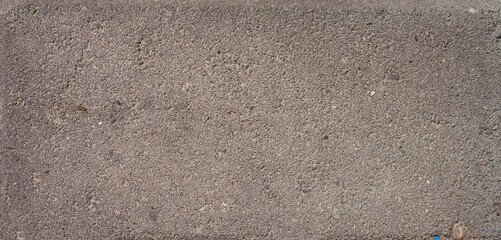 The texture of the brick is coarsely enlarged