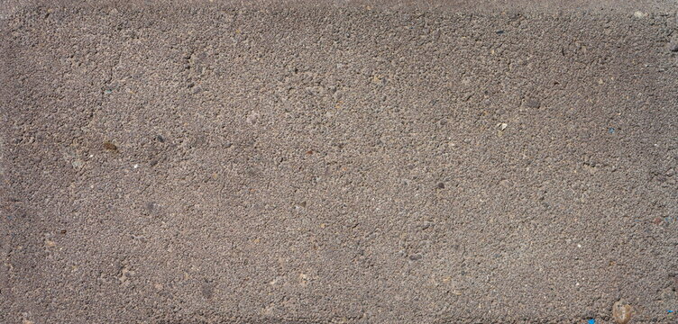 The texture of the brick is coarsely enlarged