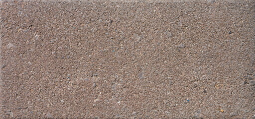 The texture of the brick is coarsely enlarged