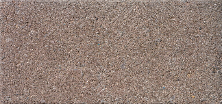 The texture of the brick is coarsely enlarged