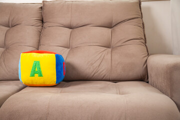 Children's plush dice with the letter A written on them. Letter concept.