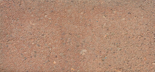 The texture of the brick is coarsely enlarged